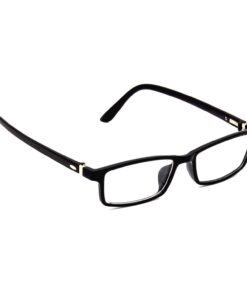 A student highlighting a textbook with a laptop open