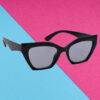 A pair of minimalist pink cat-eye sunglasses for girls