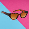 A pair of sleek silver cat-eye sunglasses for young women